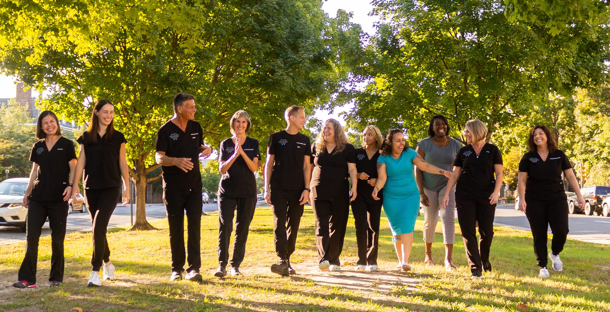 The Monument Family Dentistry team walking together outdoors